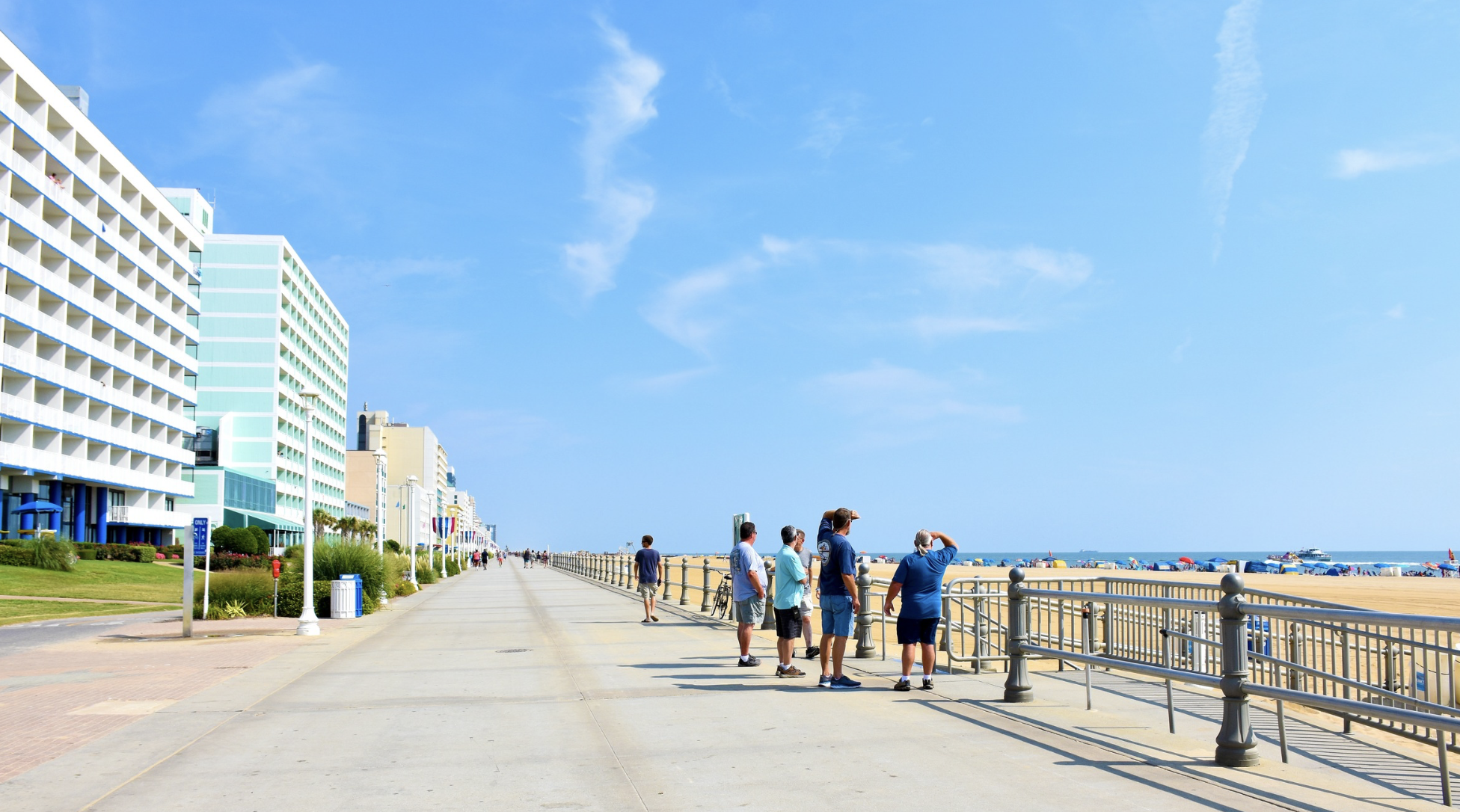 people walking along the shoreline walkway at Virginia Beach