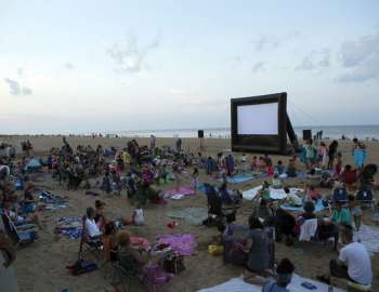 beach blanket movie with onlookers