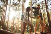 two people hiking through woods