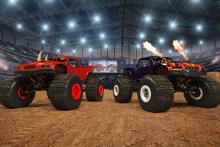 two monster trucks in an arena