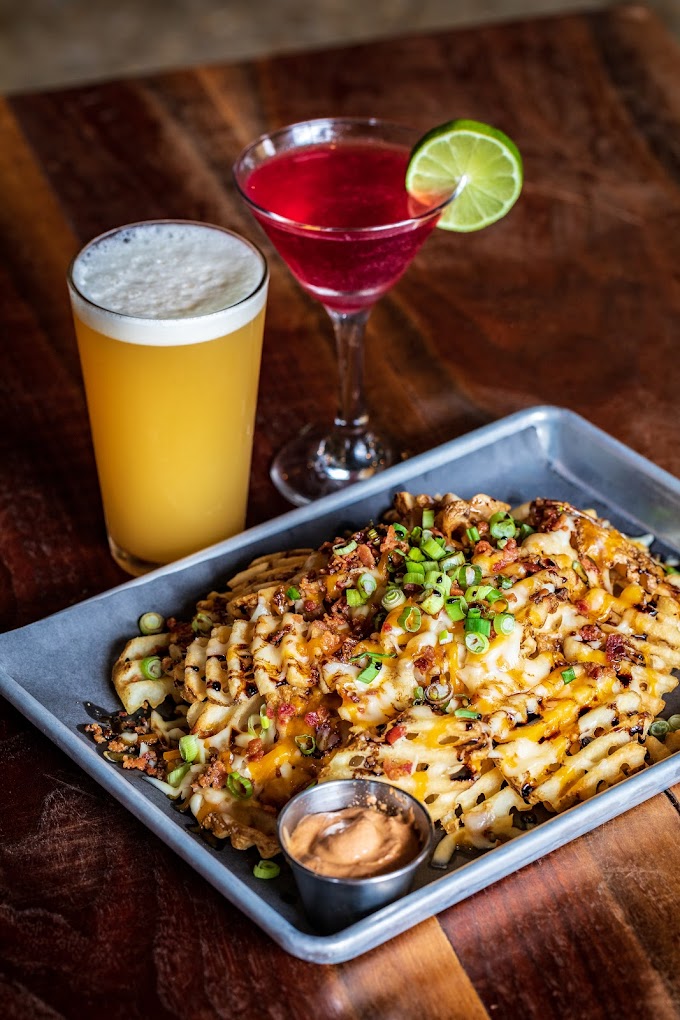 The Bunker Brewpub's Loaded Waffle Fries, a must-try dish. 