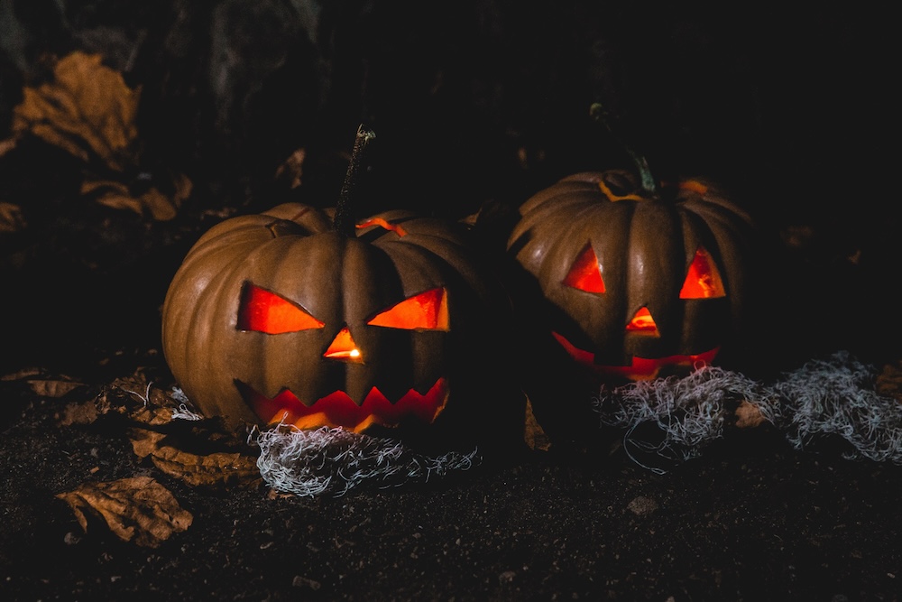 two jack-o-lanterns in the dark