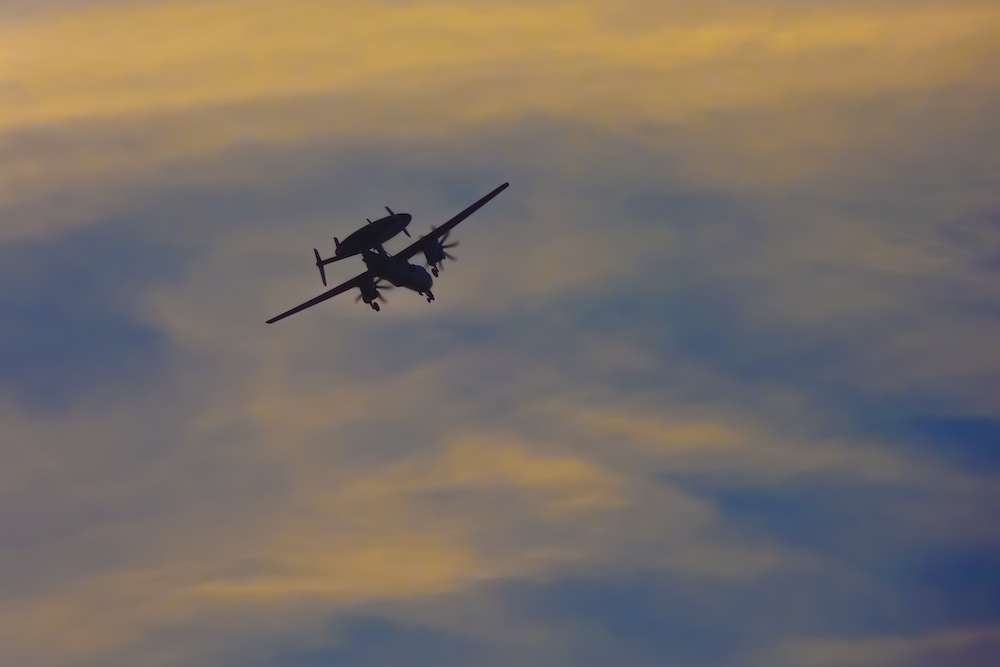 Jet flying at sunset 