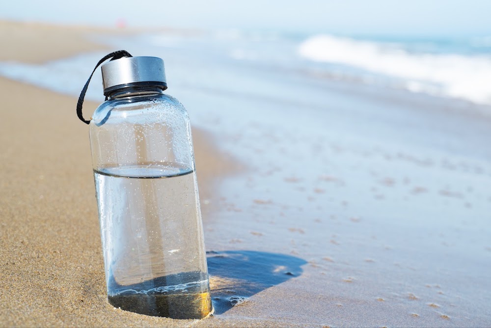water bottle in sand
